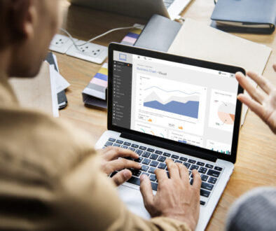 People working on a laptop in a meeting