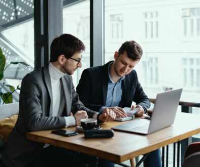 Two young businessman having a successful meeting at restaurant.